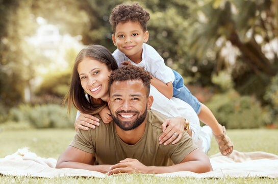 Relax, Smile And Picnic With Portrait Of Family In Park For Summer, Happy And Nature. Wellness, Spring And Health With Other And Father Embrace With Child In Grass Field Or Countryside Environment