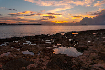 Landscape at Sunset in San Antonio Abad, Ibiza Island, Balearic. Little puddles by the sea