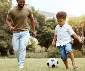 Man, boy and bonding with soccer ball in garden, house backyard or nature grass park for fun game,...