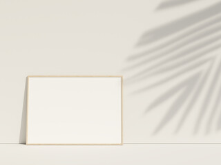 Clean and minimalist front view horizontal wood photo or poster frame mockup leaning against the wall with leaf shadow. 3d rendering.