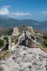 Fototapeta na wymiar The ancient castle of Rocca Calascio where the film Ladyhawke was filmed with the beautiful mountains and hills of Abruzzo in the background
