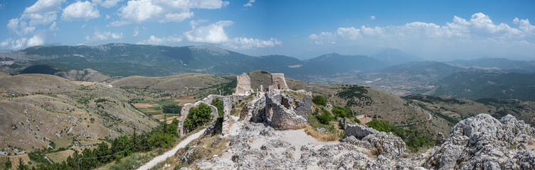 Fototapeta na wymiar Extra wide angle view of The ancient castle of Rocca Calascio where the film Ladyhawke was filmed with the beautiful mountains and hills of Abruzzo in the background
