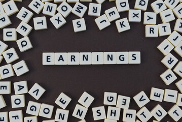 Letters spelling out earings