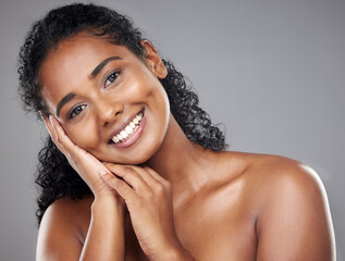 Black woman, beauty and portrait smile in skincare, cosmetics or treatment against a grey studio background. Portrait of happy African American female face smiling for cosmetic care and perfect skin
