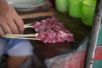 Yogyakarta, Indonesia - September 05 22: Preparing and seasoning of sate klathak. Sate kathak is a...