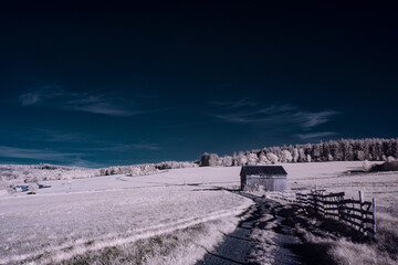 Fototapeta na wymiar infrared photography - ir photo of landscape under sky with clouds - the art of our world in the infrared spectrum