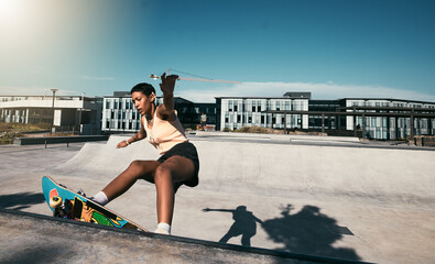 Fitness, girl and skateboarder skateboarding in a skate park for training, cardio workout and...