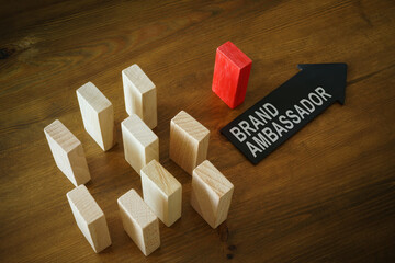 Cubes and arrow with inscription brand ambassador. - obrazy, fototapety, plakaty