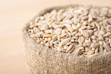 Close up shot of sunflower seeds in bag. Storage of peeled sunflower seeds used in confectionery