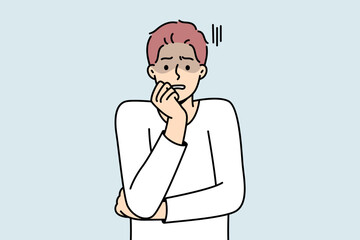 Anxious young man feeling terrified and worried. Unhappy guy feel afraid and astonished. Emotion control and mental problems. Vector illustration. 