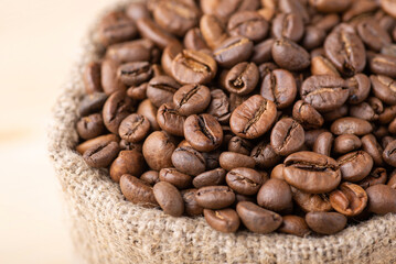 Close up shot of coffee beans in bag. Storage of aromatic roasted coffee. Making coffee concept