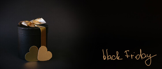 Black Friday Sale. Black gifts box with gold bow