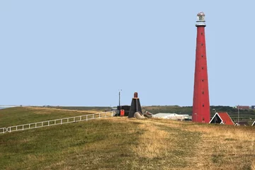 Fototapeten The red lighthouse of Den Helder in Noord-Holland © YvonneNederland