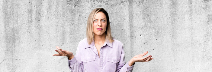blonde adult woman feeling clueless and confused, not sure which choice or option to pick, wondering