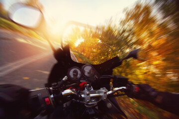 Riding a motorbike on a beautiful day in autumn - 540931147