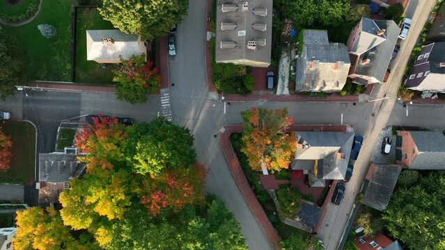 Top down aerial of historic homes in Boston Massachusetts. Colorful autumn fall foliage in golden hour light.