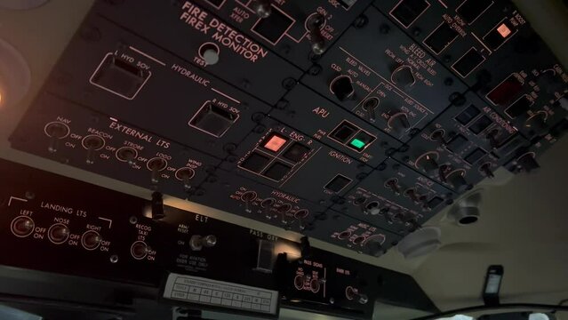 Pilot starting-un left engine in a jet, night view.