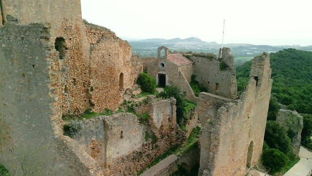 Ruined castle in Europe aerial footage cinematic medieval era  Palafolls Barcelona Girona Spain Europe