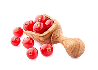 ipe fresh  red currant berries photographed closeup isolated on a white background. Berries in wooden spoon.
