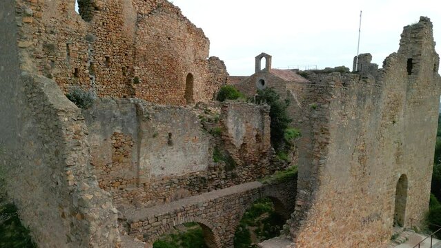 Ruined castle in Europe aerial footage cinematic medieval era Crane plane made with mini 3 drone in Barcelona Palafolls