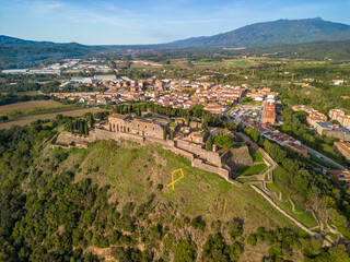Fototapeta na wymiar Aerial drone footage of Hostalric European medieval town in the mountains castle Church Cathedral trekking tourism a few minutes from Blanes and the Costa Brava
