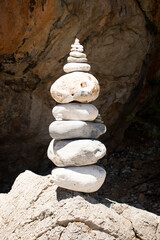Balanced Rock Zen Stack in front of rock