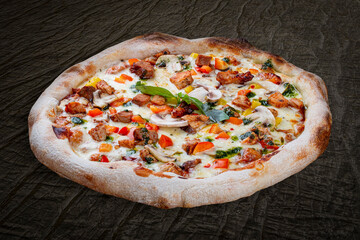 BBQ pizza with pork, chicken, bell pepper, barbecue sauce, mushroom, pesto. Neapolitan round pizza on wood background