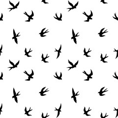 Fototapeta na wymiar Seamless pattern of black swallows. Black silhouette on a white background. Black contours of flying birds. Flying swallows. vector illustration isolated on white background.