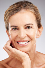 Skincare, face and portrait of senior woman in studio with beauty, cosmetic and health routine. Happy, smile and elderly lady with wrinkles isolated by gray background with wellness anti aging facial