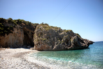 Exotic beach in Greece with clean waters and rocks Foneas beach Nudist beach