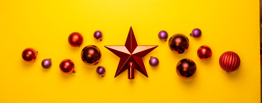red shiny christmas star with balls flat lay, abstract layout