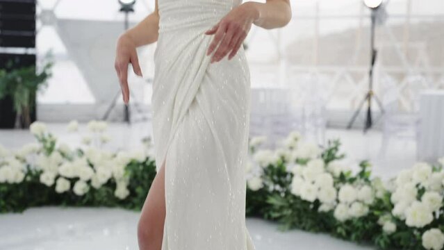 A long wedding dress on a middle-aged model.