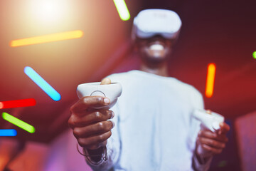 Man, VR gaming innovation and controller for metaverse, digital fantasy and cyber video game in neon lighting. Gamer hands, virtual reality and 3d futuristic games experience with glasses technology