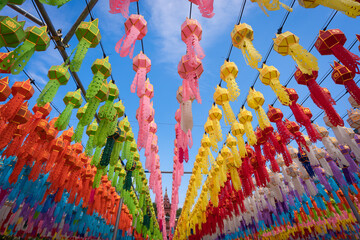 Beautiful Lantern Lamp light colorful decoration in Loi Krathong Festival hung up on the rail to pray the prosperity at Wat Phra That Hariphunchai, Lamphun province Thailand.