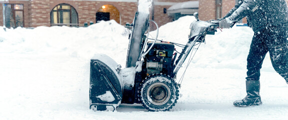 a snow plow removes snow on the playground