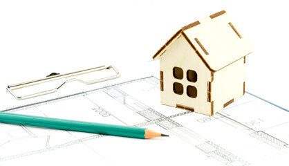 keys and the layout of the house on the drawings. the concept of buying and building housing