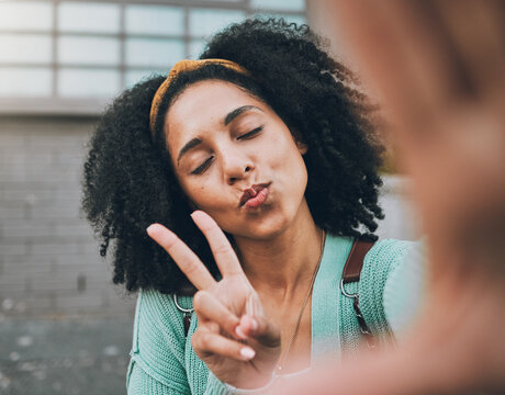 Selfie, peace and black woman pouting in the city for social media, internet or a mobile app. Young, trendy and face of an African girl with photo smile, fashion and hand sign for the web online