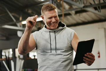 Gordijnen Thumbs up, tablet or wellness man on video call for networking, communication or personal trainer selfie for social media. Health, gym or happy coach for thank you, motivation or success workout goal © S Fanti/peopleimages.com