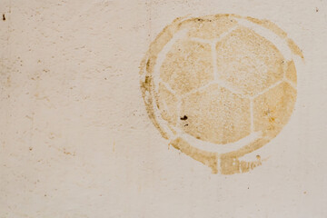 Football print on cement background,soccer slough on wall.