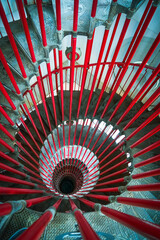 Double spiral staircase and red balustrade. Double spiral modern spiral staircase in the restored historic tower of Ljubljana Castle, Slovenia.