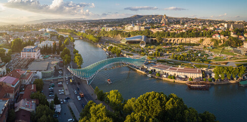 Aerial view of downtown Tbilisi, Georgia. In the foreground is the Peace Bridge over the Mtkvari River. © mikelaptev