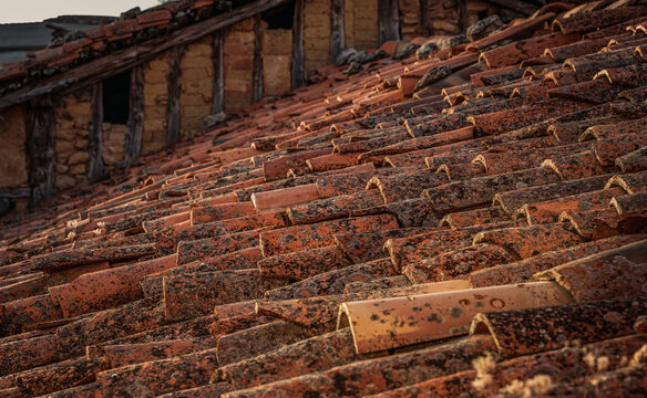 Rustic red tile roof in an old village in Spain, Vintage style, Old village house in Burgos