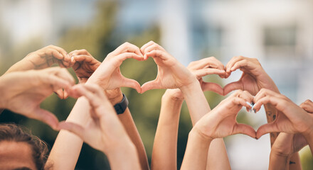 Hand, heart and love with a group of people making a sign with their hands outdoor together in the day. Crowd, freedom and community with man and woman friends doing a gesture to promote health - obrazy, fototapety, plakaty