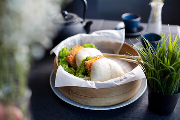 Bao Buns Asian bun with fried tofu, served in a basket