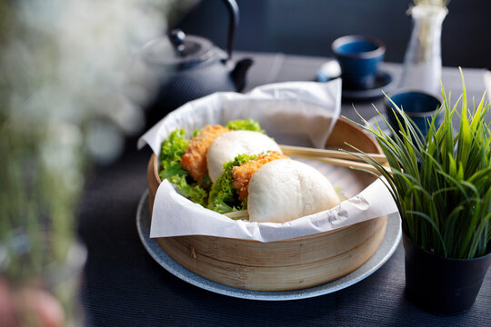 Bao Buns Asian bun with fried tofu, served in a basket