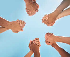 Hands, solidarity and holding hands, support and collaboration, partnership and diversity with blue...