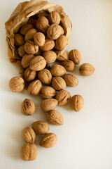 Nuts are scattered on the table from the craft package