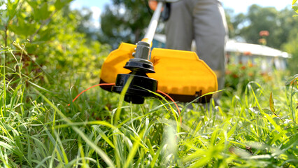 LAWN MOWER MOWS LAWN TRIMMER