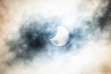 Obraz na płótnie Canvas Partial Solar Eclipse on a Cloudy Day 25.10.2021 in Czechia