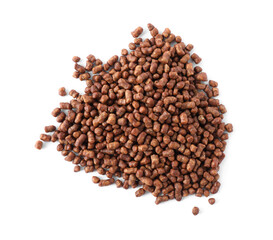 Pile of buckwheat tea granules on white background, top view